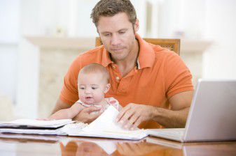 Father and baby in dining room with laptop 34064