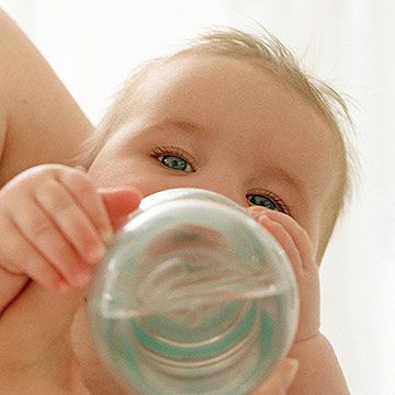 baby drinking water out of bottle