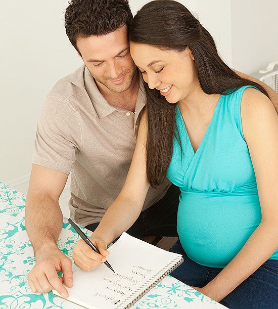 couple looking at baby name list