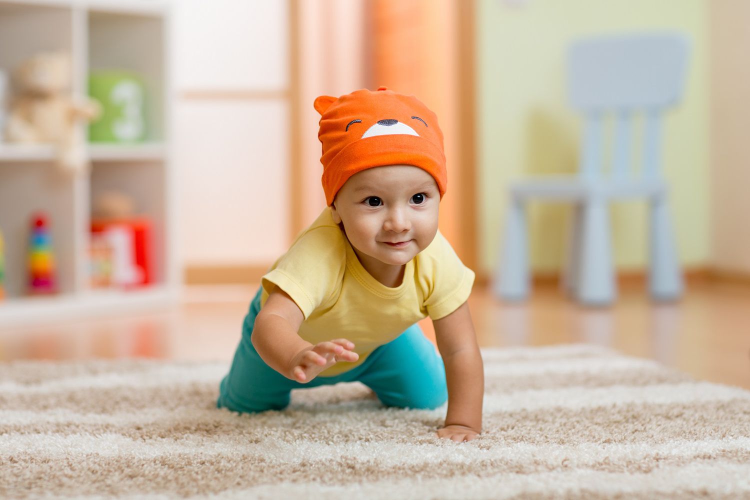 crawling baby with hat