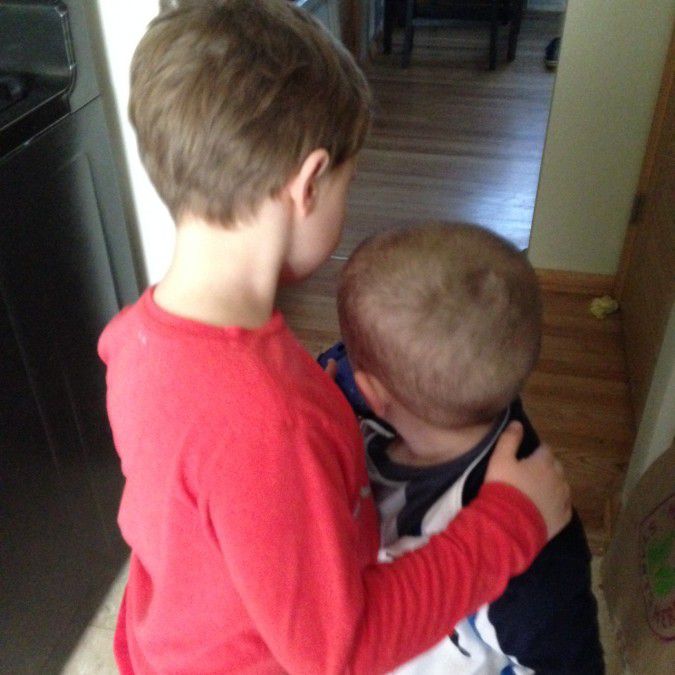 Liam hugging his brother