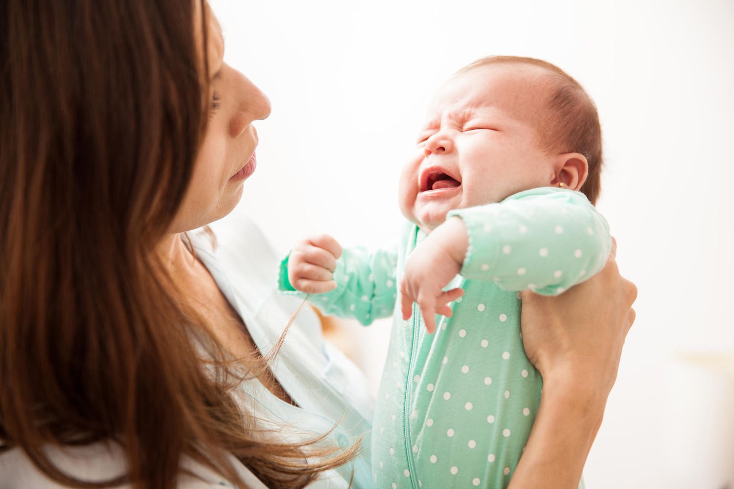 Concerned Woman Picks Up Crying Baby