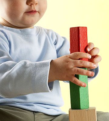 baby playing with blocks