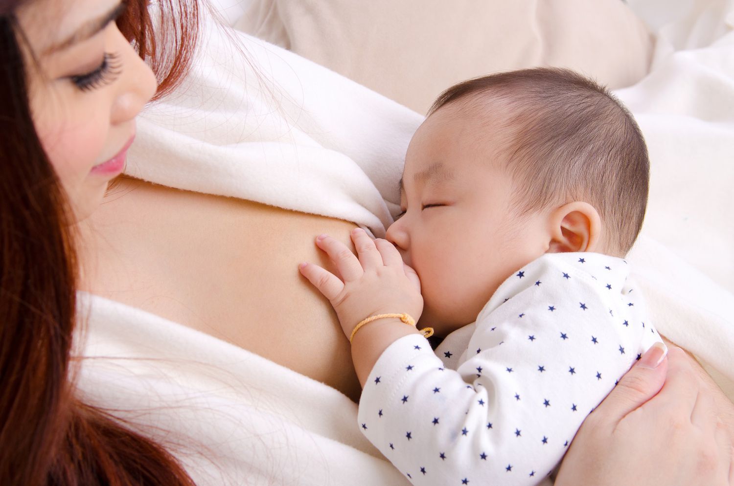 Asian Baby Breastfeeding Mom