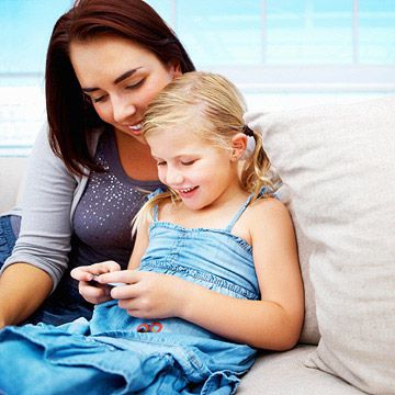 mother and child looking at phone
