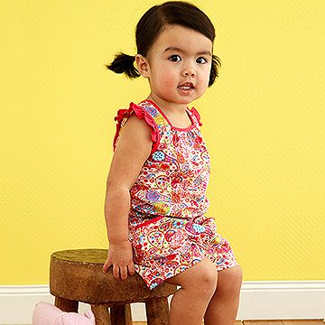 toddler sitting on stool
