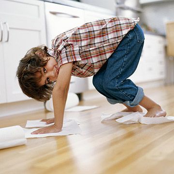 boy cleaning floor