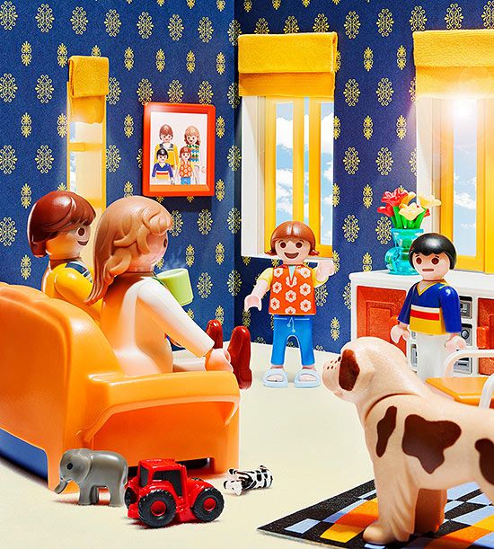 Playmobil figures in a living room set