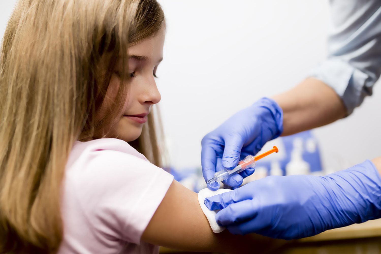 tween girl getting vaccine shot