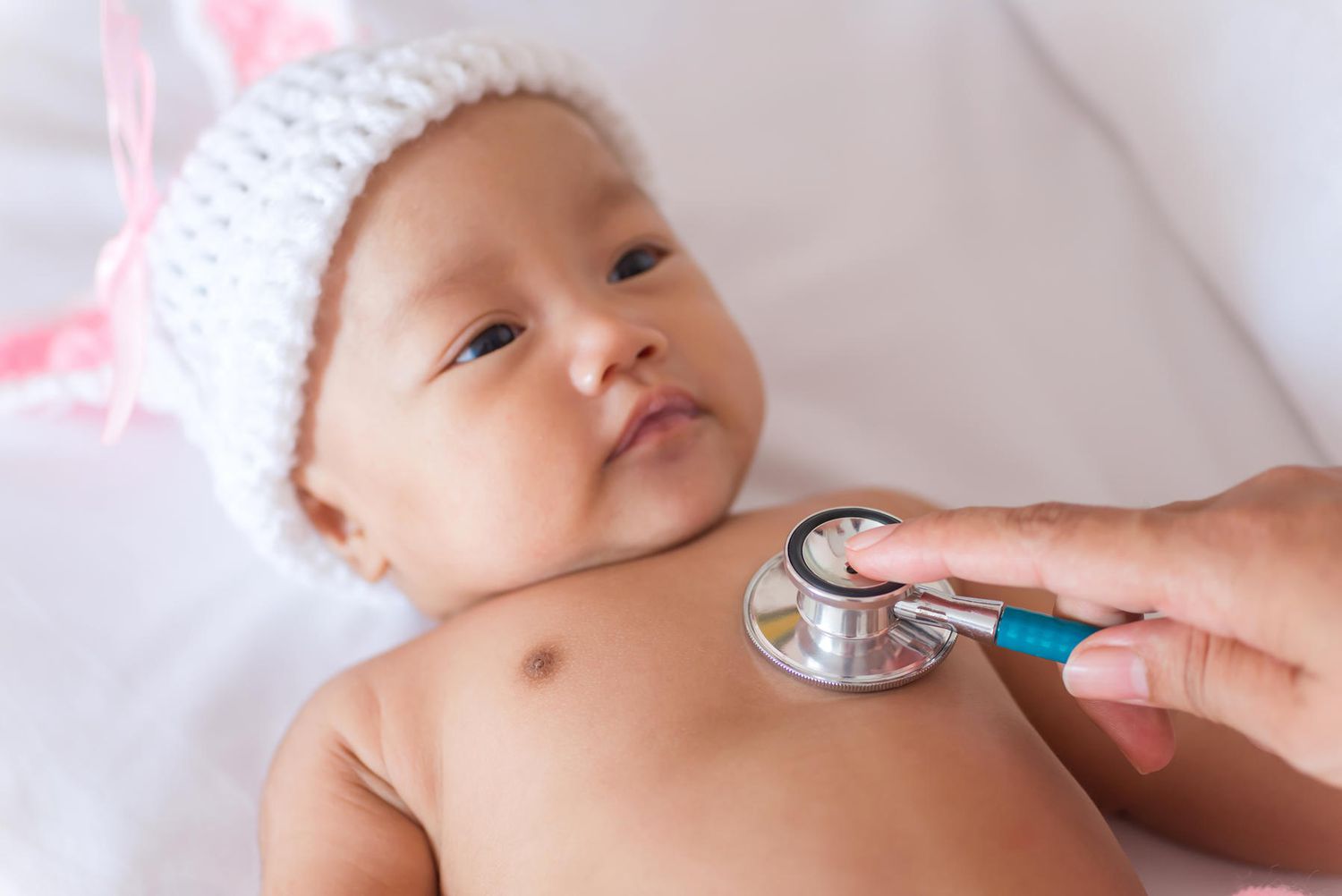 Baby with stethoscope over heart