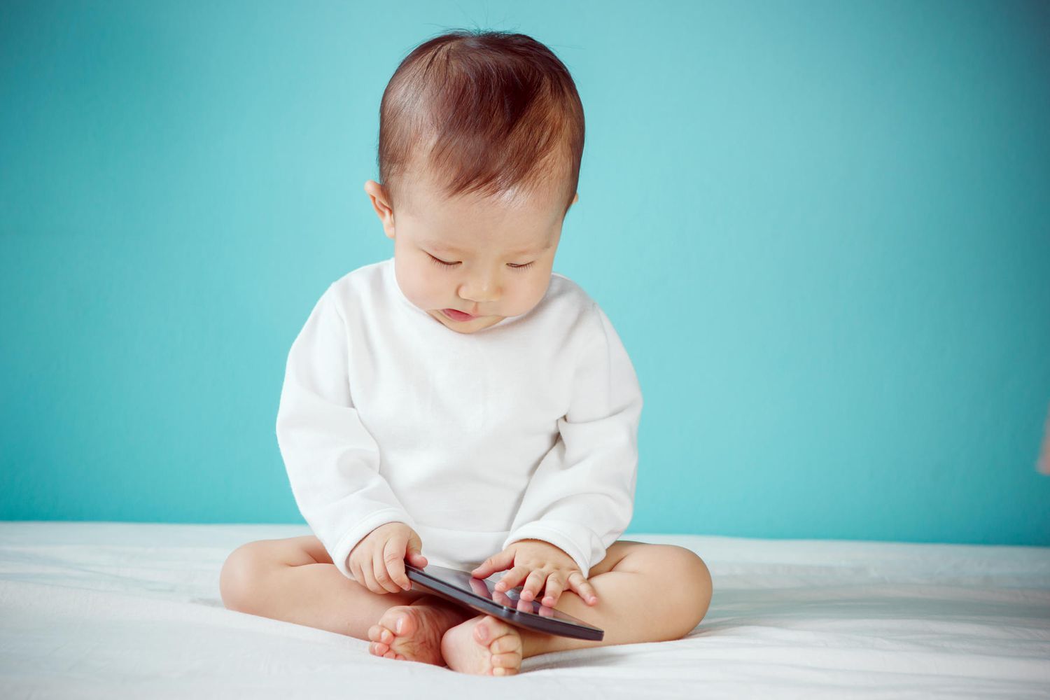 baby playing with smartphone