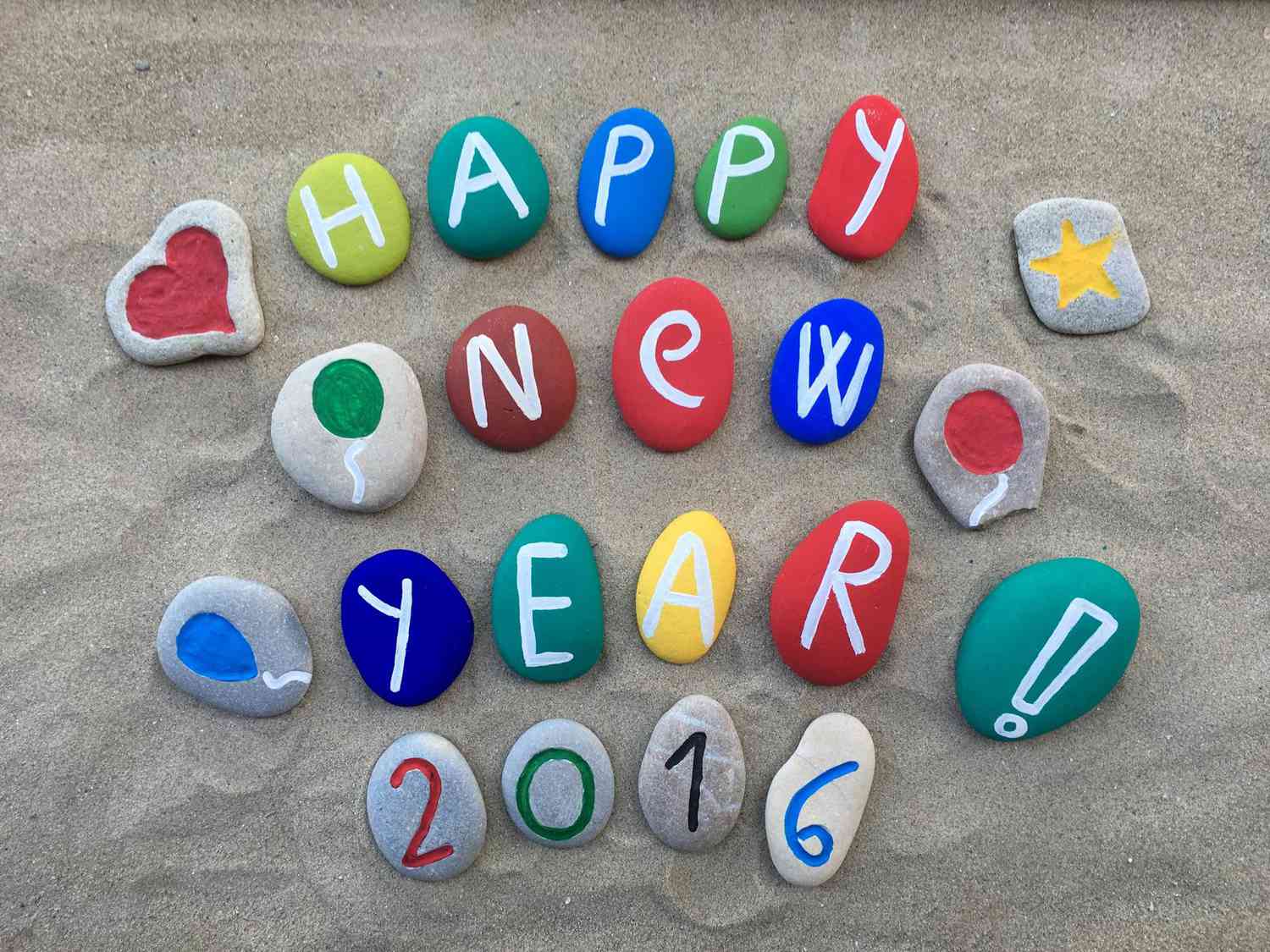 Happy New Year 2016 stones on sand