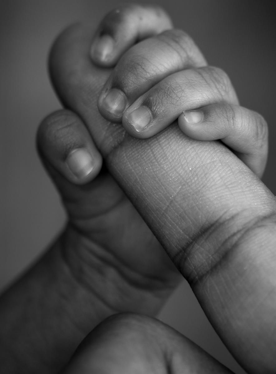 black and white preemie baby hand