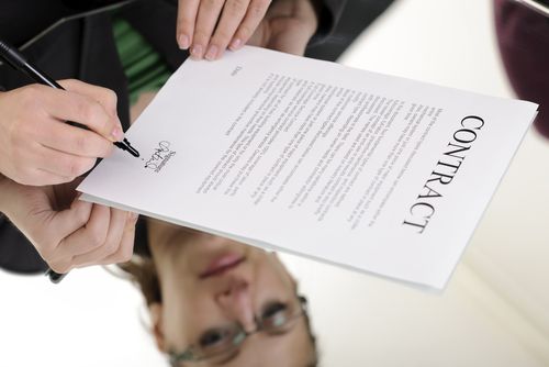 woman signing job contract