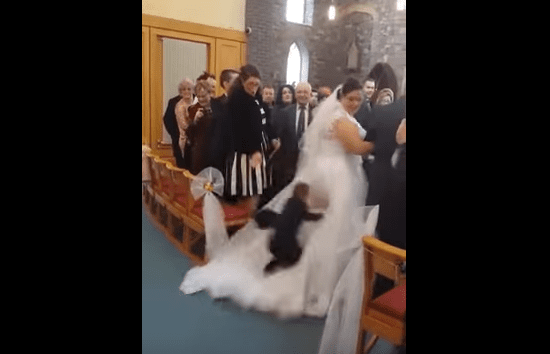 boy-dives-on-wedding-dress.png