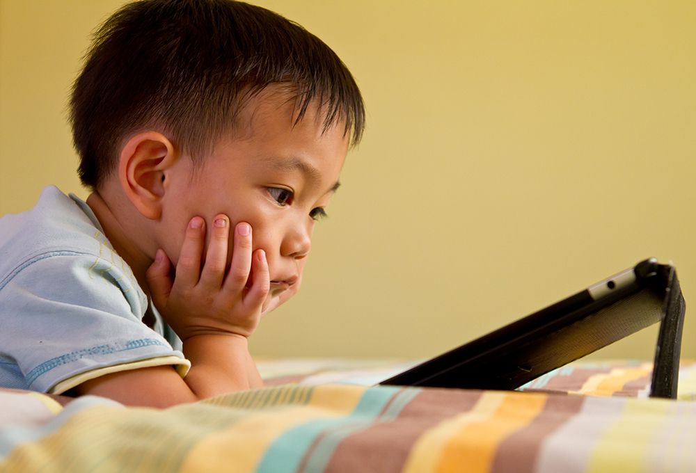 boy watching tablet