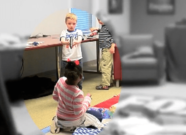 Kids pick up and play with gun they find in gun safety video.