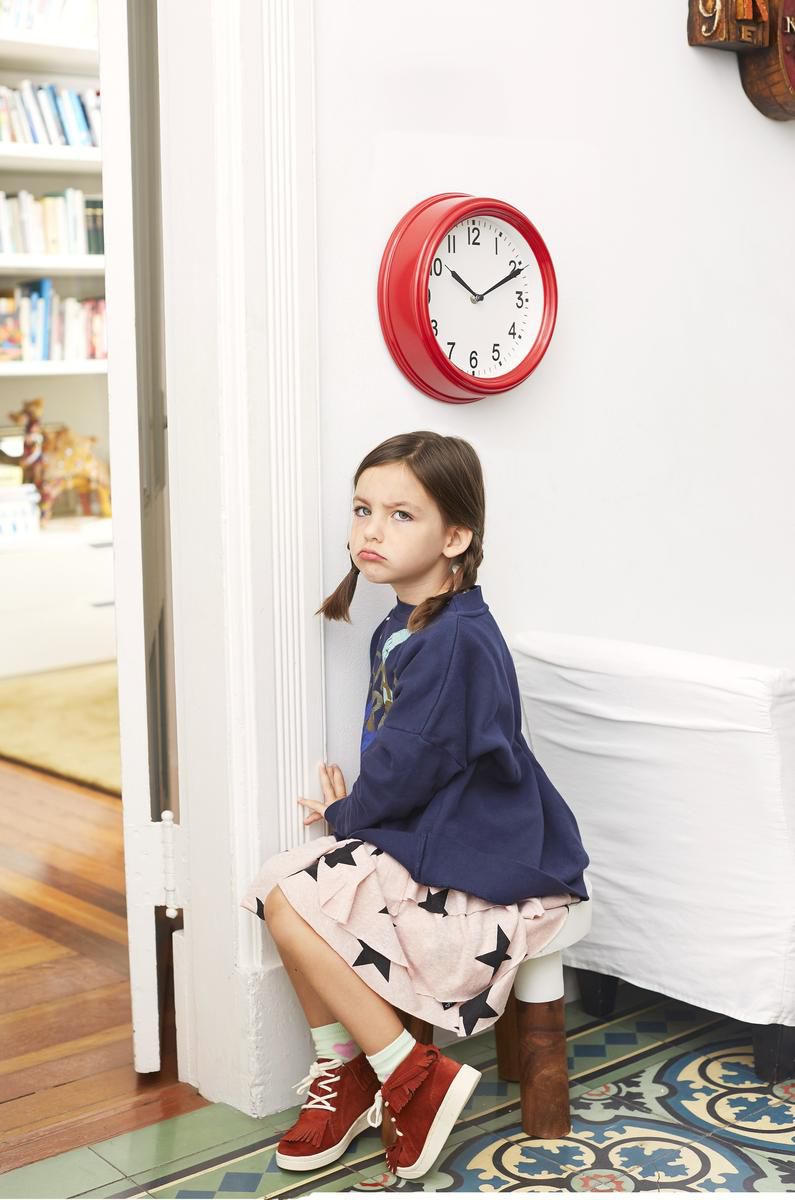 Little Girl Upset Sitting on Time Out in Corner