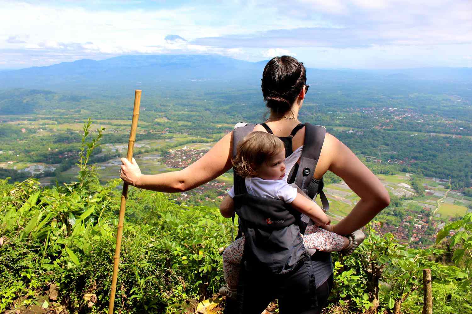 Erica Weber Carrying Daughter on Back Indonesia Hike