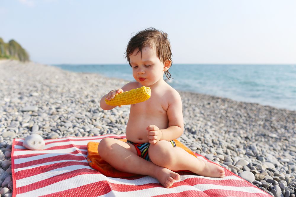 Summer Eats Toddler Eating Corn On The Beach