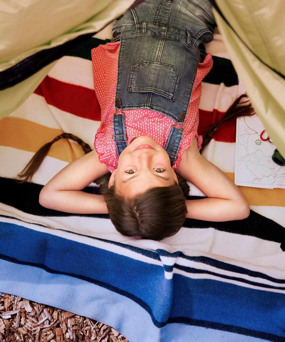 Camping Destinations Girl Laying Down Inside A Tent