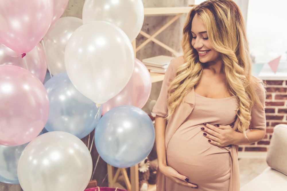 Pregnant Woman at Baby Shower with Balloons