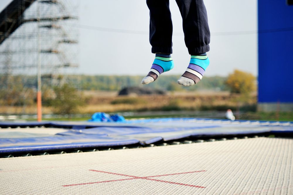 boy jumping at trampoline park