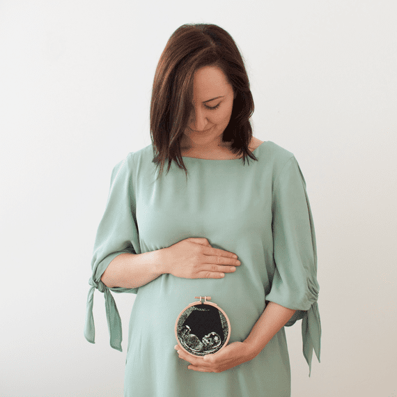 Mint Green Dress Woman Holds Embroidery Ultrasound Photo
