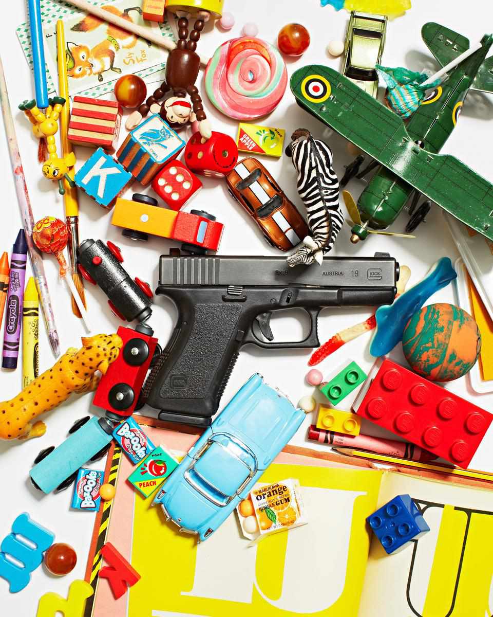 Gun On Table With Toys and Candy