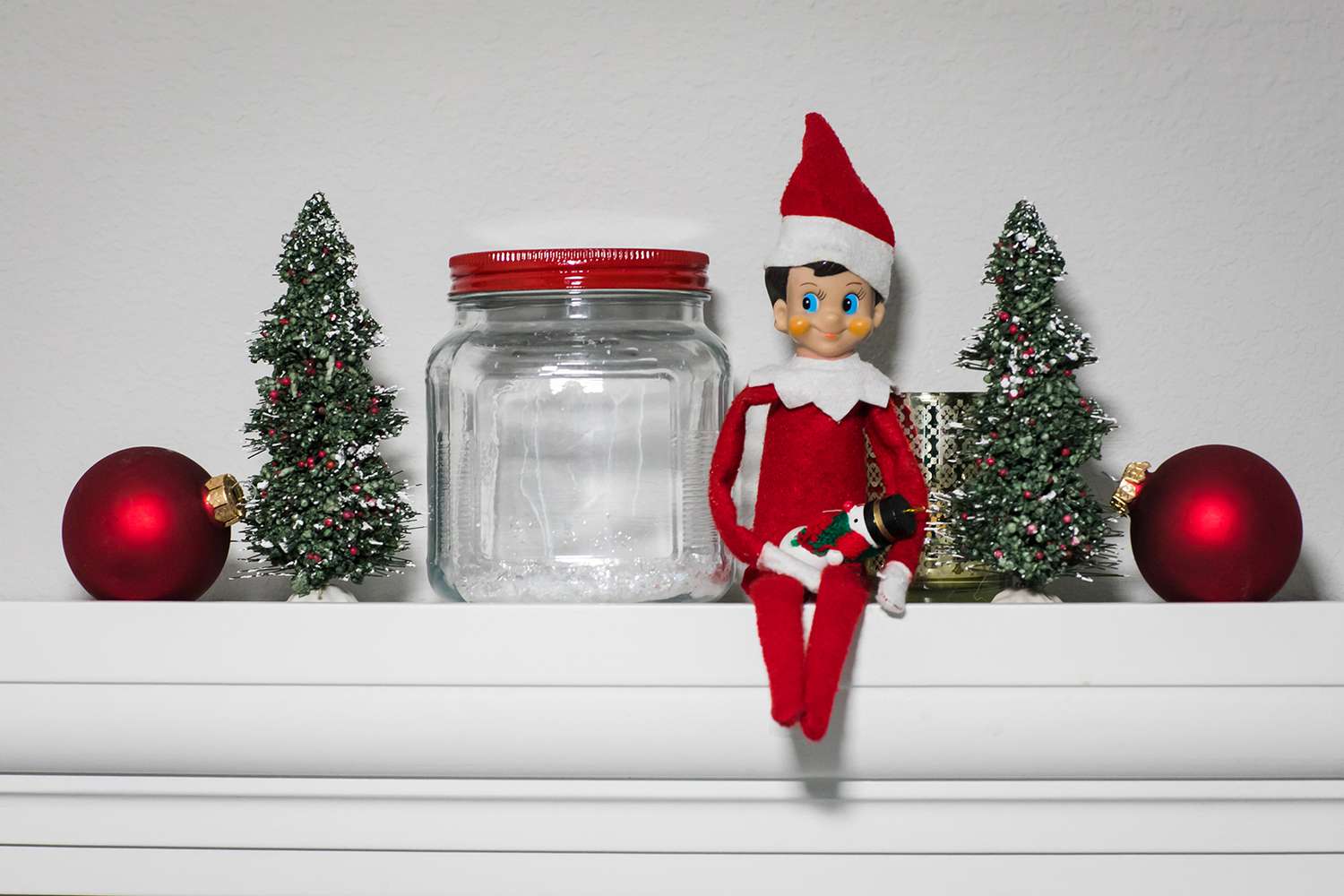 Elf on a Shelf Around Christmas Decorations
