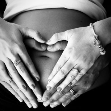 heart hands on pregnant belly