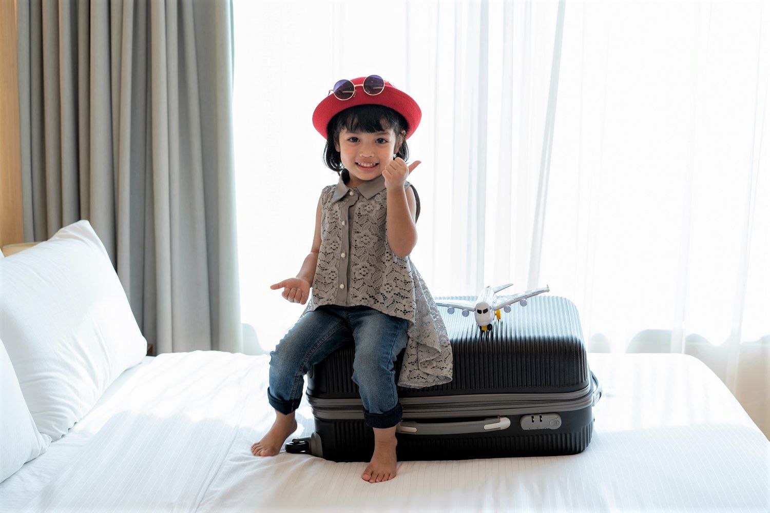 Young Asian Girl Sitting on Luggage Traveling Kids Suitcase