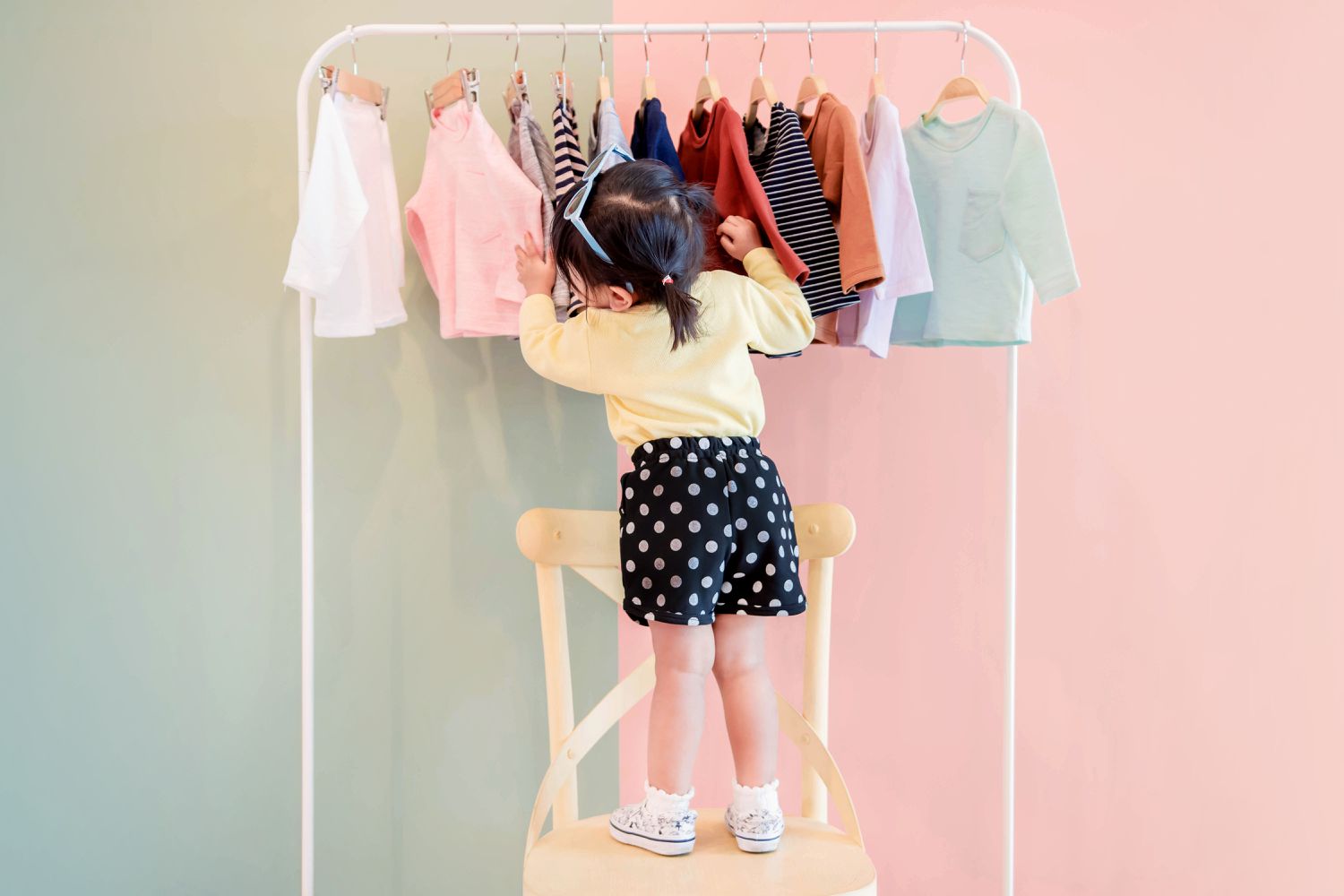 girl with clothing rack