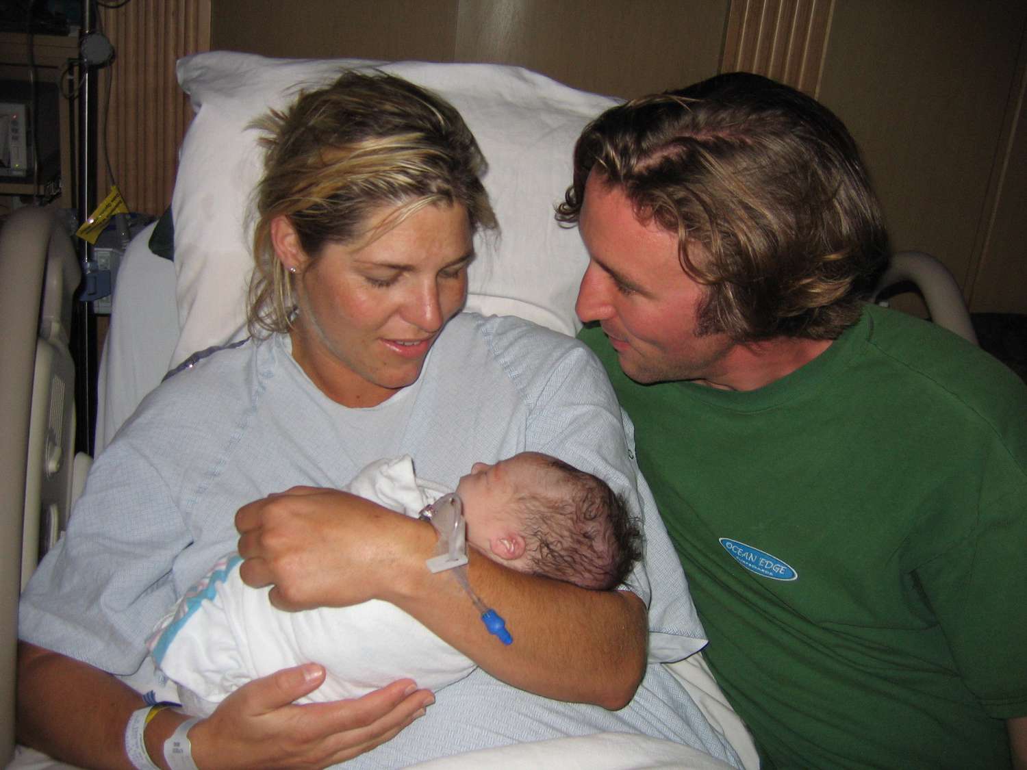 Hilary Achauer holds her child after giving birth.