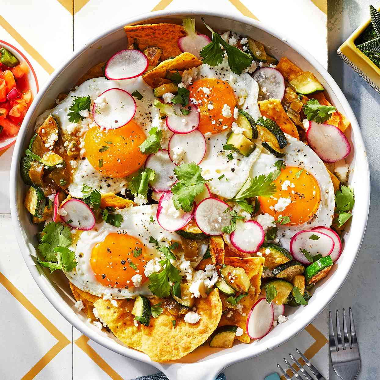 Chilaquiles Verdes in white cooking dish