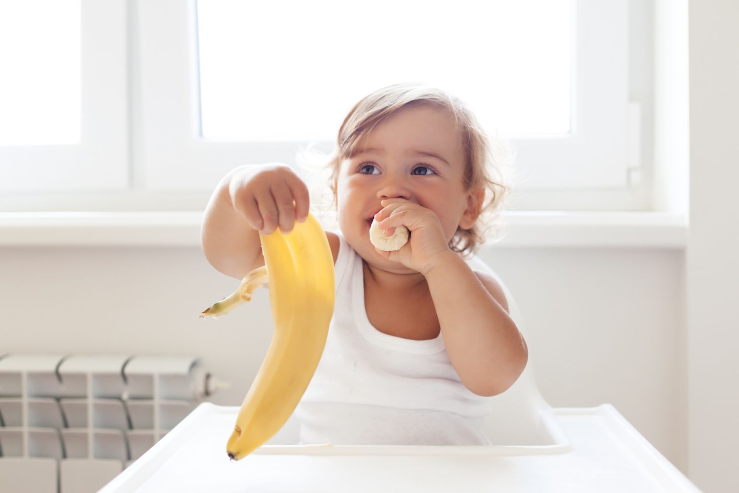 baby eating banana