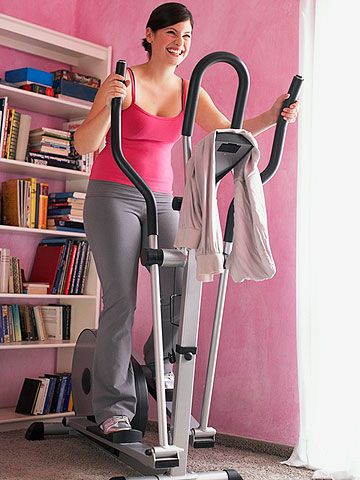 woman exercising on the elliptical trainer