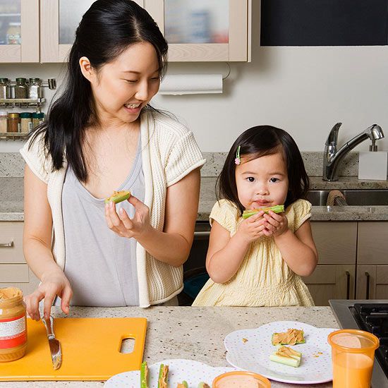 mother and toddler eating healthy snack