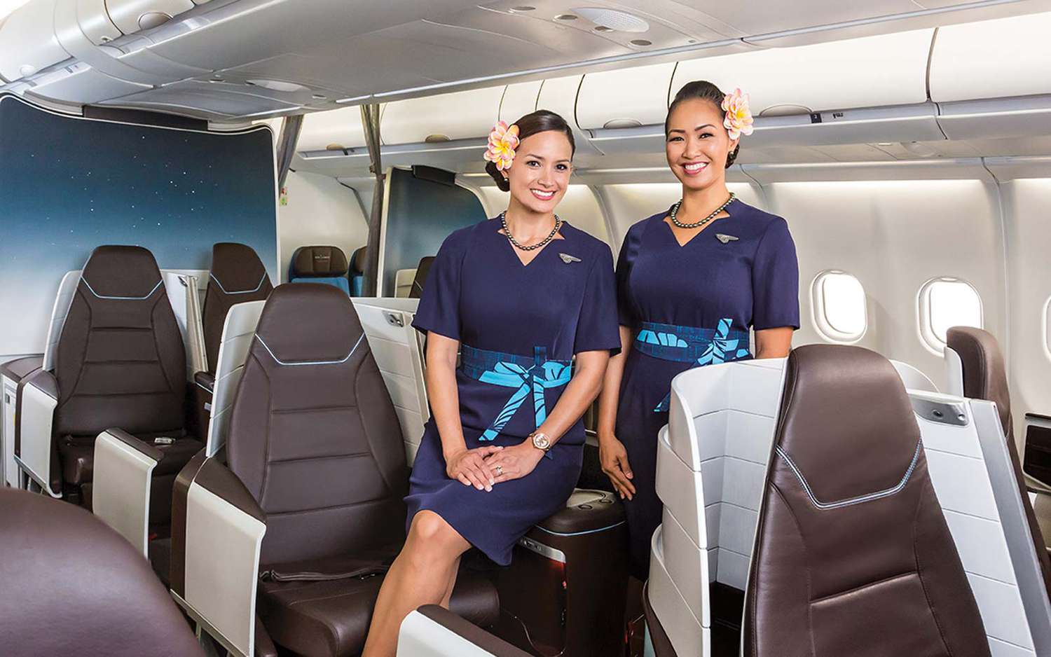 Hawaiian Airlines Female flight attendants Smile Inside Plane