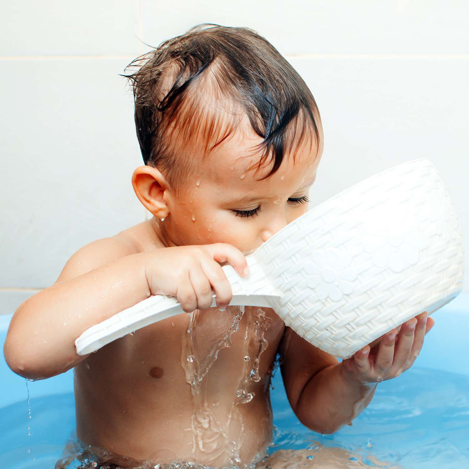 baby drinking bathwater