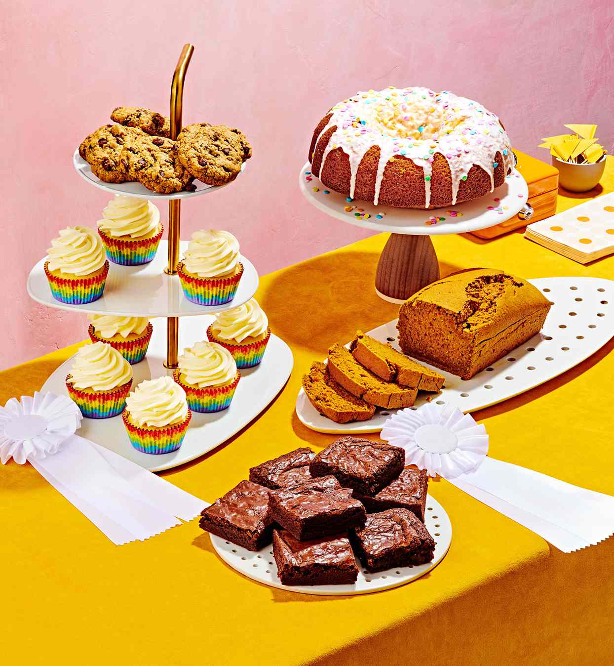 yellow table with various baked goods on display