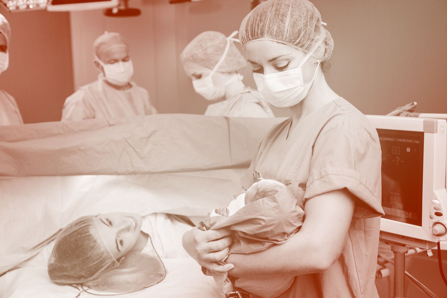 nurse with baby after mother's c-section