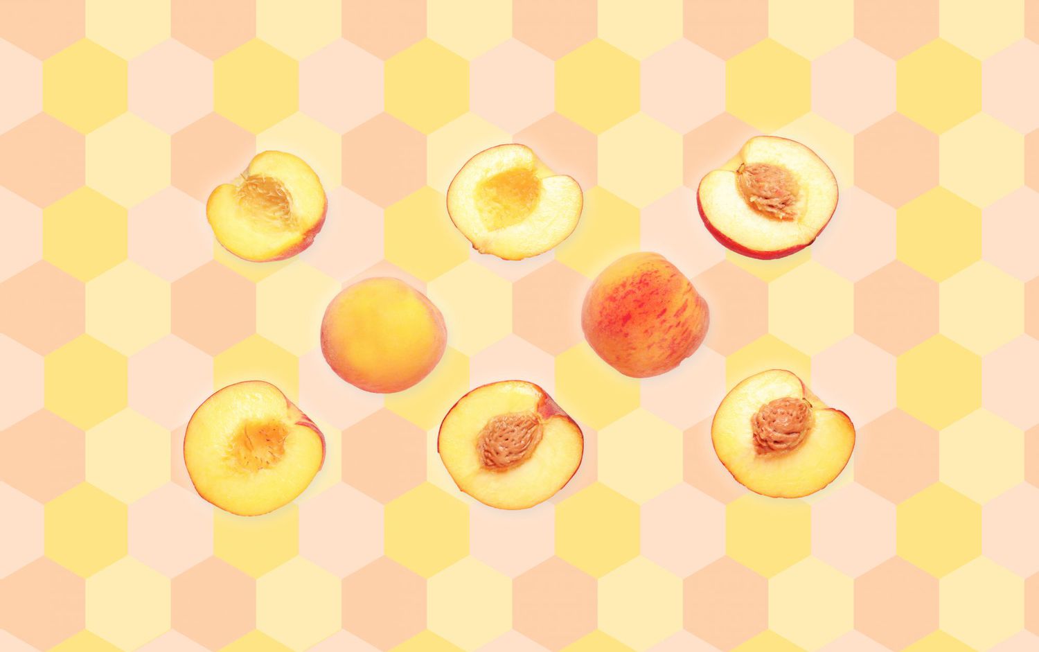 whole peaches and halved peaches on patterned background