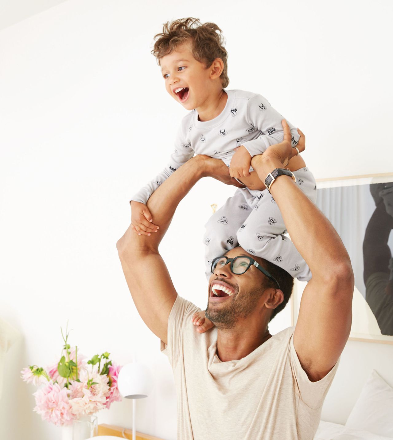dad lifting son over head