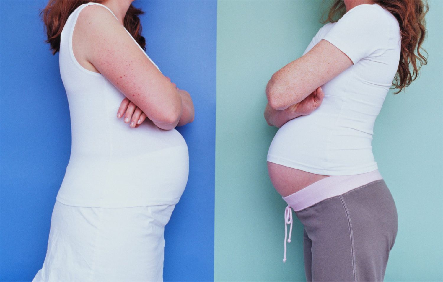 two pregnant women facing each other