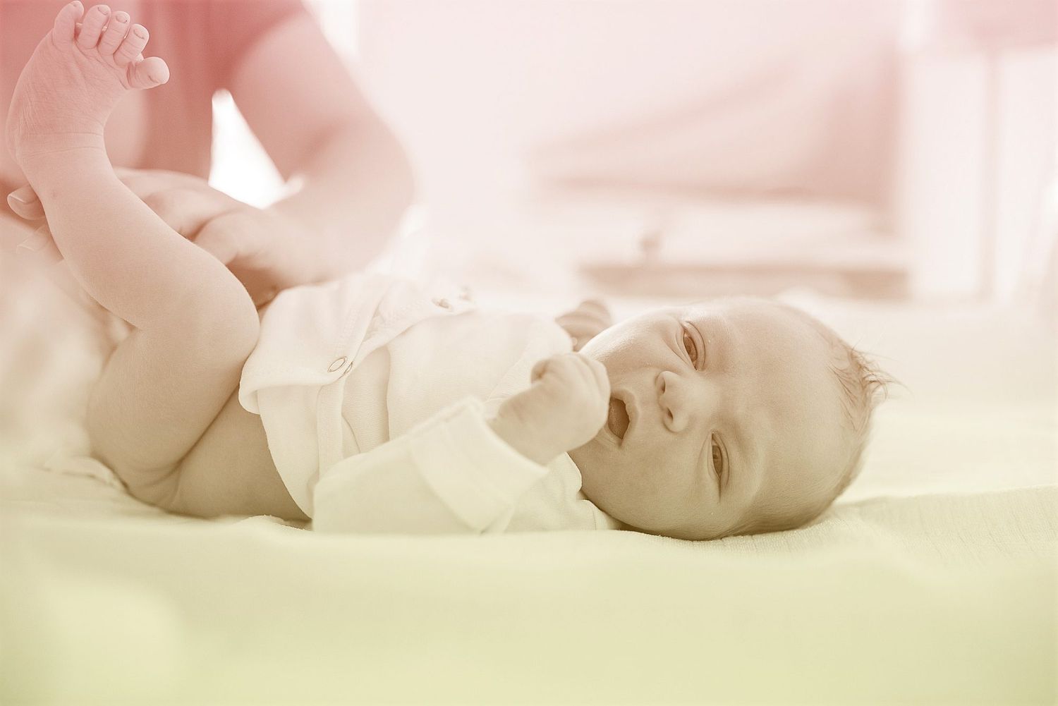 newborn baby laying down during diaper change