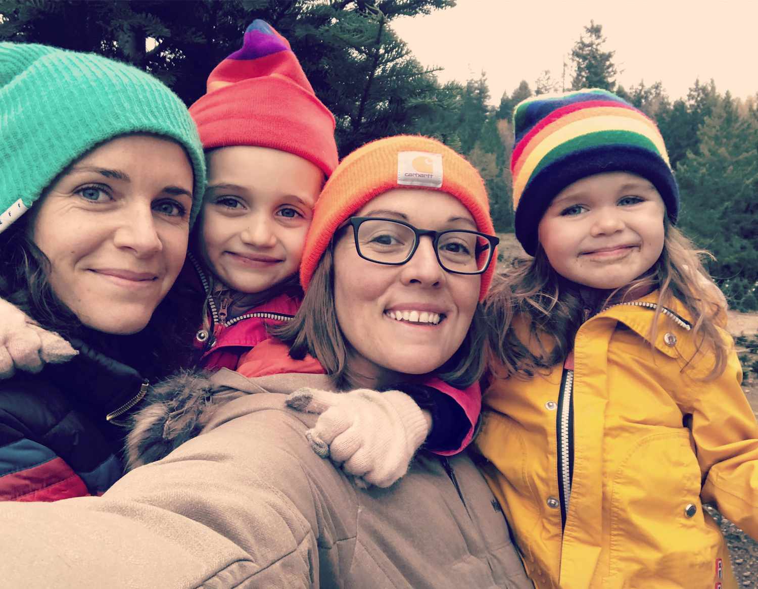 family selfie in colorful hats