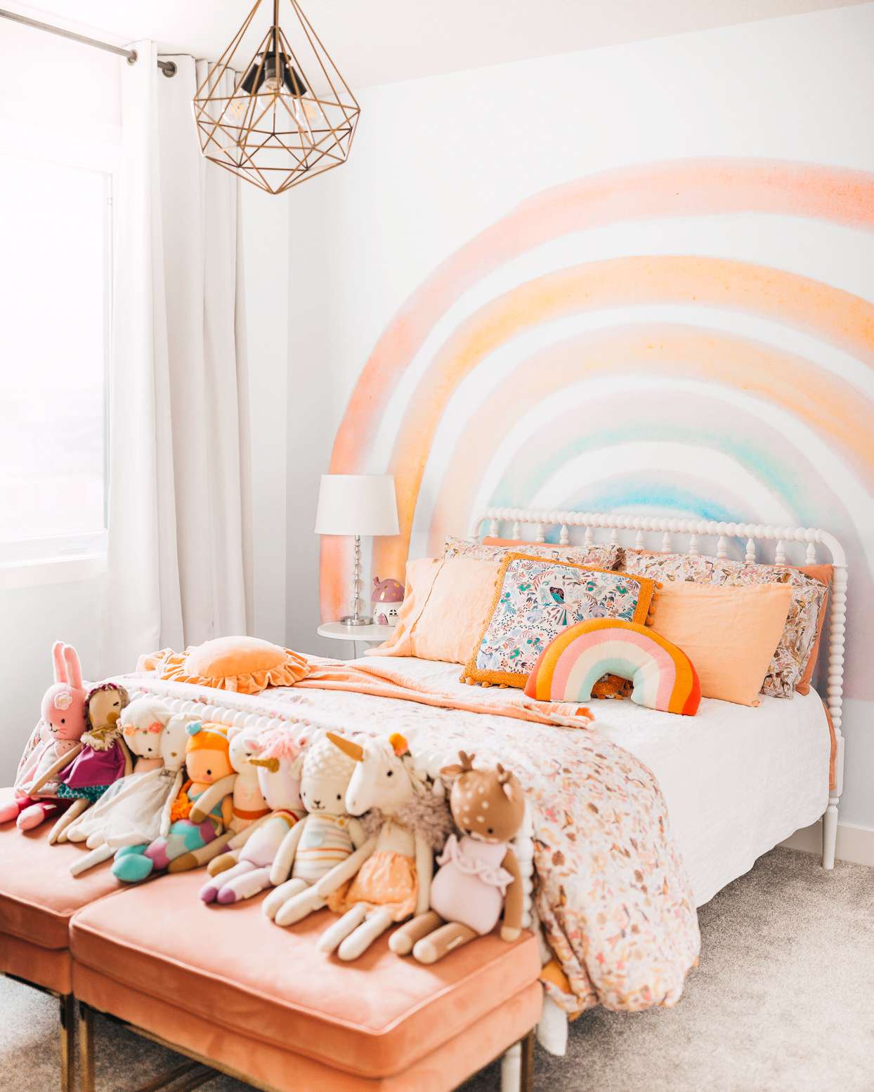childs room with rainbow accent wall