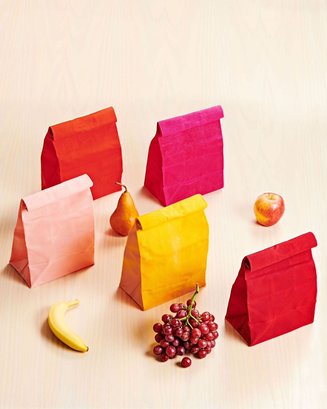 packed school lunches colorful paper bags and fruit