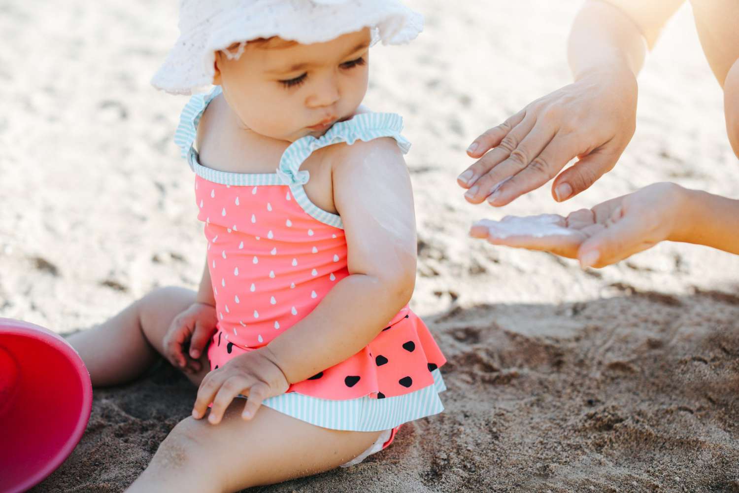 An image of a baby on a beach.